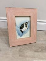 Front view of framed watercolor cat portrait