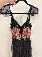 Front view showing embroidered bodice and mesh flutter straps