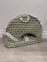 pillow in clear vinyl carry pouch showing overall shape and pattern