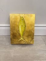 Full view of fish artwork on gold leaf wood panel