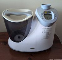 Front and top view of Honeywell humidifier showing water tank, controls, handle