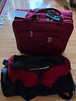 Suitcase and duffel front view