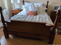 Full view of assembled queen bed frame with headboard, footboard and side rails