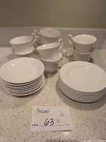 Stacked teacups, saucers and small plates