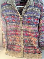 Full view of front of cardigan on hanger