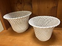 Both porcelain orchid planters front view