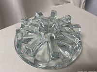 Top view of clear glass radial fin teapot warmer