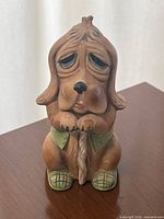 Front view of bisque hound dog bank