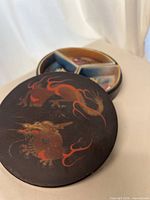 Lacquer box with lid removed showing porcelain wedges
