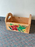 front view showing floral painting, cutout handle