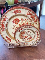 front view showing large charger, dinner plate, salad plate in rack