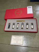 closed red Tradition Toy Soldiers box with item label and display of six figures in foam insert