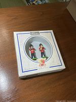 Front view of Britains boxed set showing figures through circular window