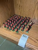 Full group of 44 Britains marching soldiers on shelf