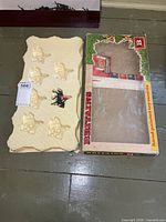 Tray showing single mounted guard figure and box