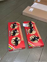 Two Britains Metal Models boxed sets on floor