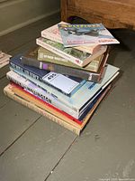 Stack of eleven military books assorted sizes