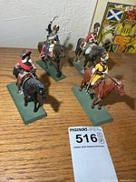 All four mounted soldier figurines on bases