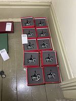 Group of ten boxed Britains mounted soldiers on floor