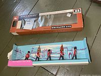 Full set on insert beside outer box showing all components