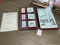Presentation box, certificate of authenticity and inner cartons displayed