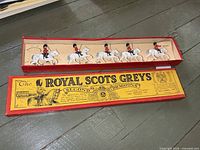 Full view of boxed set with lid and five mounted figures