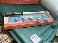 Full boxed set showing five figures and branding