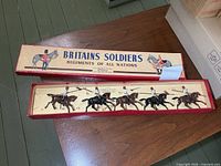 Box lid and open insert showing five mounted figures