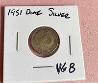 1951 Canadian dime in cardboard flip front, VG8 notation visible