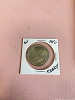 Obverse of 1972-D Kennedy half dollar in holder