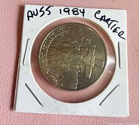 Reverse side of 1984 Cartier Canadian silver dollar in holder