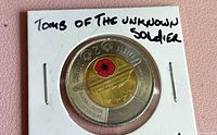 Obverse view of coin in 2×2 holder with handwritten identifier