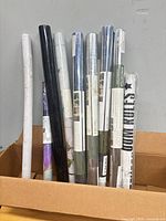 Box showing all 11 sealed rolls standing upright
