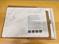 Mat in box with protective foam