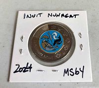 Reverse side of coin in 2×2 flip showing coloured Inuit Nunangat design and handwritten label
