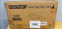 Front of sealed box showing brand, type, wattage, quantity, warranty logo