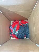 Red tropical-print garment and grey garment in box