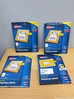 Four Avery label packs on table: three 8126, one 8463