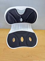 Front view showing full seat and backrest with foam pads and cut-outs