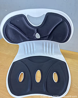 front view showing overall support cushion with black inserts and cutouts