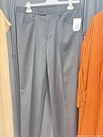 Front view of gray pinstripe pants hanging
