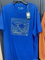 Front view of blue tentree T-shirt with graphic and hangtag visible