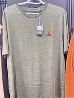 Front view of olive green tentree T-shirt on hanger
