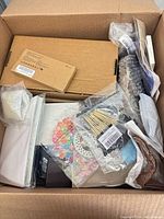 Overview of box showing various sealed items