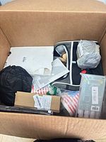 Overview of assorted items inside cardboard box