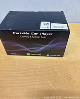 Retail box showing Portable Car Player CarPlay & Android Auto branding