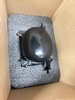 Compressor seated in foam inside original shipping carton