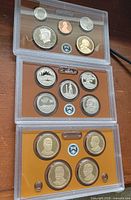 All three plastic lenses showing 14 proof coins