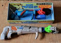 Boxed Robo Xtendor toy and loose Robo Xtendor toy on surface