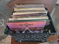 Crate containing large stack of vinyl LPs